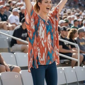 Michael Kors women Top asymmetrical Size Medium Fits XL Flowy Soft Orange Blue